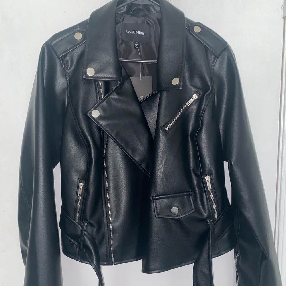 All black, new leather jacket with belt.